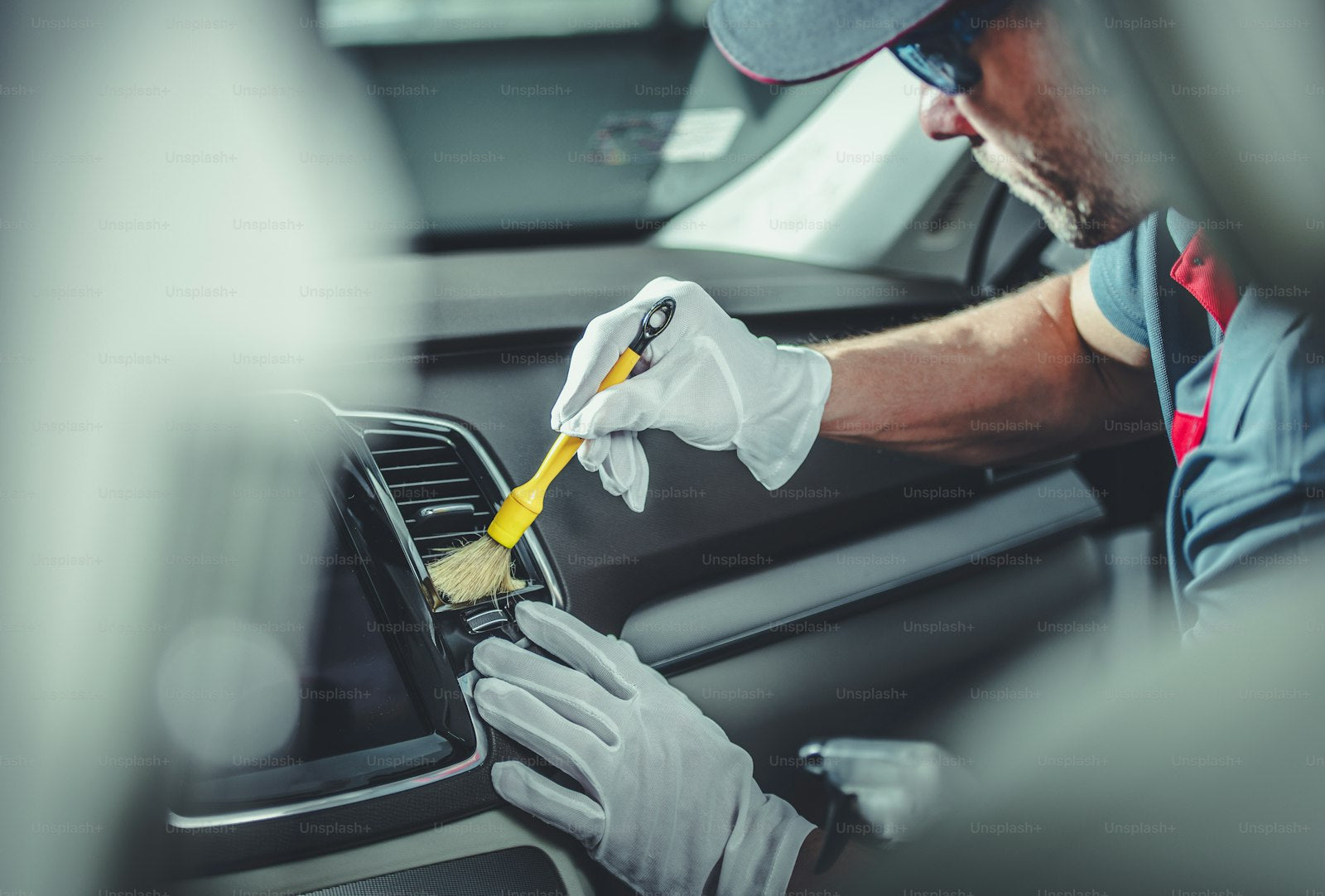 Cleaning car interior with detailing tool